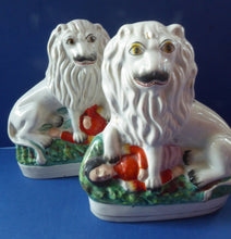 Load image into Gallery viewer, ANTIQUE Pair of Staffordshire Lions Showing the British Lion Trampling on a Recumbent Figure of the French Emperor, Napoleon III
