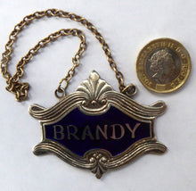 Load image into Gallery viewer, 1930s SILVER PLATE and Royal Blue Guilloche Enamel Brandy Decanter Label
