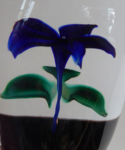 Sweet Vintage Strathearn Paperweight with delicate little upright dark blue flower. Paper label &  S75 millefiori signature cane