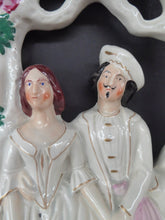Load image into Gallery viewer, HUGE Antique STAFFORDSHIRE Figurine of a Couple sitting in a bower of fruiting vine; Height 13 1/2 inches
