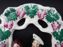 Load image into Gallery viewer, HUGE Antique STAFFORDSHIRE Figurine of a Couple sitting in a bower of fruiting vine; Height 13 1/2 inches
