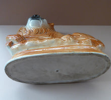 Load image into Gallery viewer, Large ANTIQUE Victorian Staffordshire Recumbent Lion with Glass Eyes. 11 inches in length
