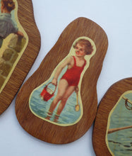 Load image into Gallery viewer, STRANGE 1950s Wooden Plate Mats - with Stylish Seaside or 1950s Beach Illustrations on each
