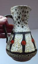 Load image into Gallery viewer, Vintage 1970s West German Pottery Handled Vase or Pitcher. JASBA WARE with Orange Polka Dot Pattern. 6 3/4 inches high
