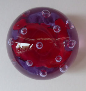 SCOTTISH GLASS. Vintage Caithness Paperweight Entitled DIABELO. 1993 Purple and Red Swirls with Controlled Air Bubbles