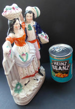Load image into Gallery viewer, Where is this? ANTIQUE Victorian Staffordshire Flatback Figurine. Rarer Example of a Man and Woman at a Gate Collecting Grapes
