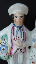 Load image into Gallery viewer, ANTIQUE Victorian Staffordshire Figurine. Lovely Wee Man and Woman with Baskets Full of Flowers
