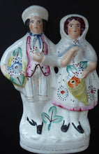 Load image into Gallery viewer, ANTIQUE Victorian Staffordshire Figurine. Lovely Wee Man and Woman with Baskets Full of Flowers
