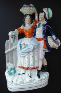 ANTIQUE Victorian Staffordshire Flatback Figurine. Rarer Example of a Man and Woman at a Gate Collecting Grapes