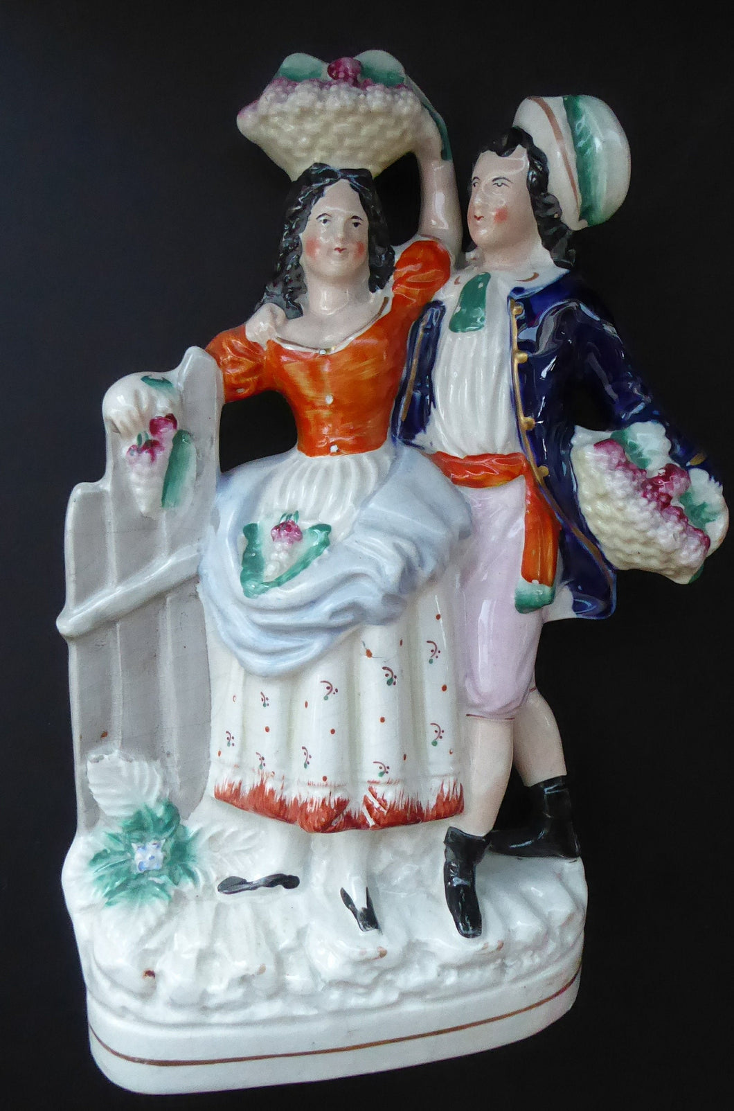 Where is this? ANTIQUE Victorian Staffordshire Flatback Figurine. Rarer Example of a Man and Woman at a Gate Collecting Grapes