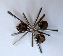Load image into Gallery viewer, SCOTTISH SILVER 1970s ORTAK Starburst Brooch. Designed by Malcolm Grey.  Set with Three Smoky Quartz Stones. Hallmarked

