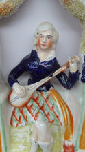 Load image into Gallery viewer, ANTIQUE Victorian Staffordshire Figurine. Lady Dressed in a Short Plaid Skirt Seated Under a Bough Playing a Lute
