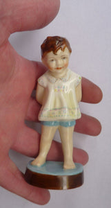 Beautiful 1950s Freda Doughty Royal Worcester Figurine: TOMMY 2913. Issue with brown hair, yellow shirt and blue shorts