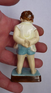 Beautiful 1950s Freda Doughty Royal Worcester Figurine: TOMMY 2913. Issue with brown hair, yellow shirt and blue shorts
