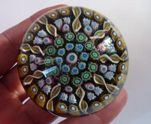 Load image into Gallery viewer, Gorgeous Colours. Scottish Glass - Strathearn Millefiori Canes and Latticino Nine Spoke Paperweight
