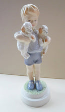 Load image into Gallery viewer, Royal Worcester Figurine MONDAY&#39;S CHILD.  Modelled by Freda Doughty. No 3519. Boy Holding Puppies. PRISTINE
