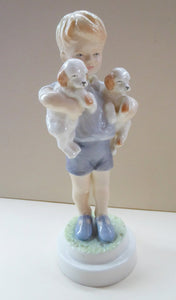 Royal Worcester Figurine MONDAY'S CHILD.  Modelled by Freda Doughty. No 3519. Boy Holding Puppies. PRISTINE