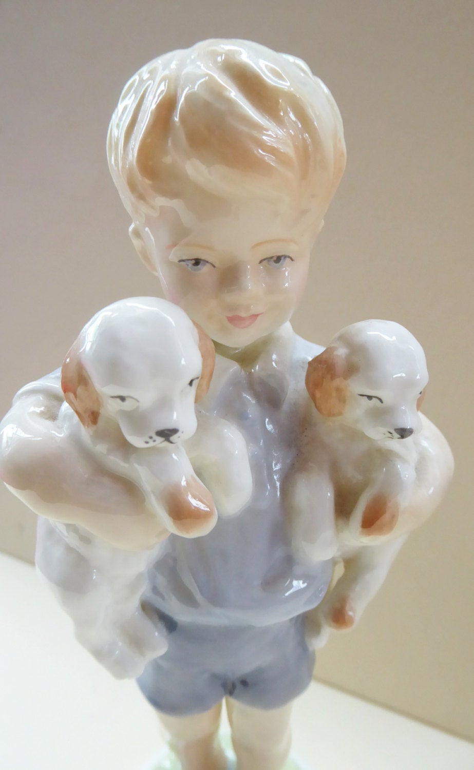 Royal Worcester Figurine MONDAY'S CHILD.  Modelled by Freda Doughty. No 3519. Boy Holding Puppies. PRISTINE
