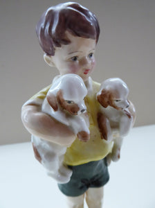 Royal Worcester Figurine. ALL MINE.  Modelled by Freda Doughty. No 3519. Boy Holding Puppies. PRISTINE
